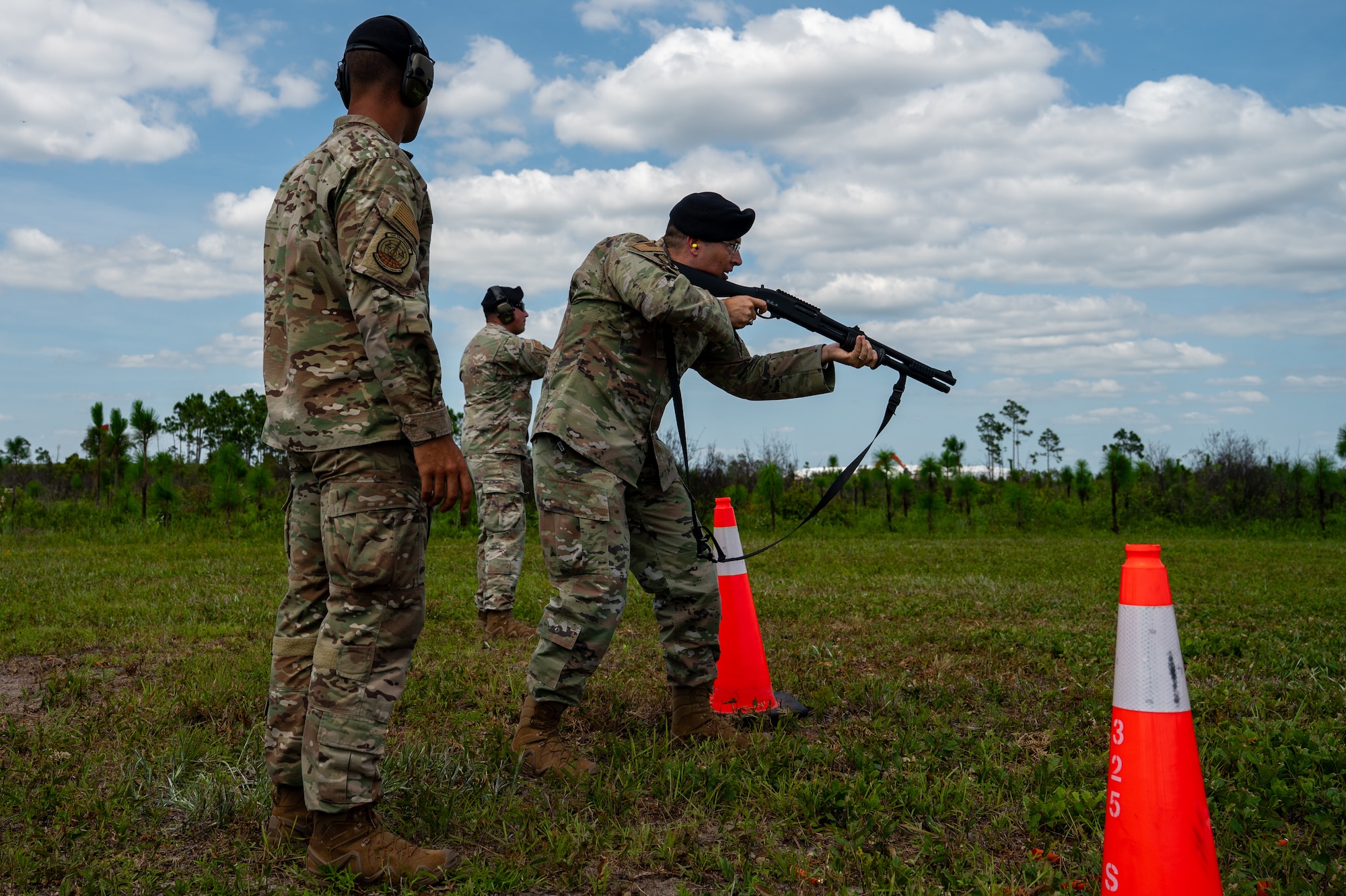 U.S. Air Force Maj. Gen. Thomas P. Sherman, commander of the Air Force Installation and Mission Support Center, and Chief Master Sgt. Ronnie J. Woods, AFIMSC command chief, greet Airmen assigned to the 325th Security Forces Squadron at Tyndall Air Force Base.