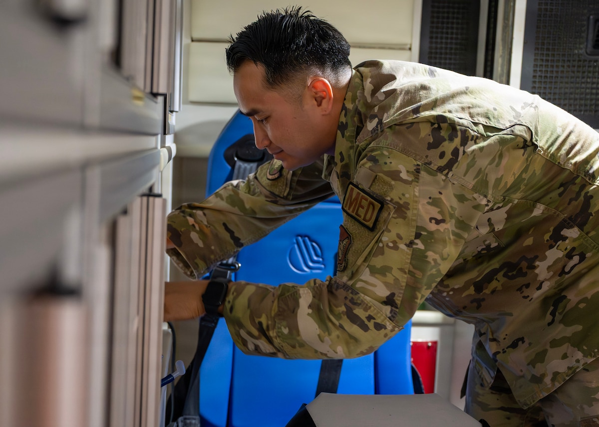 U.S. Air Force Staff Sgt. Tin Phan, 51st Operational Medical Readiness Squadron base operational medicine clinic noncommissioned officer in charge, checks inventory of an ambulance at Osan Air Base, Republic of Korea, June 10, 2026. Phan is committed to serving others by helping Airmen navigate medical requirements, preparing personnel for deployments or supporting his teammates. (U.S. Air Force photo by Staff Sgt. Sarah Williams)