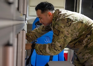 U.S. Air Force Staff Sgt. Tin Phan, 51st Operational Medical Readiness Squadron base operational medicine clinic noncommissioned officer in charge, checks inventory of an ambulance at Osan Air Base, Republic of Korea, June 10, 2026. Phan is committed to serving others by helping Airmen navigate medical requirements, preparing personnel for deployments or supporting his teammates. (U.S. Air Force photo by Staff Sgt. Sarah Williams)