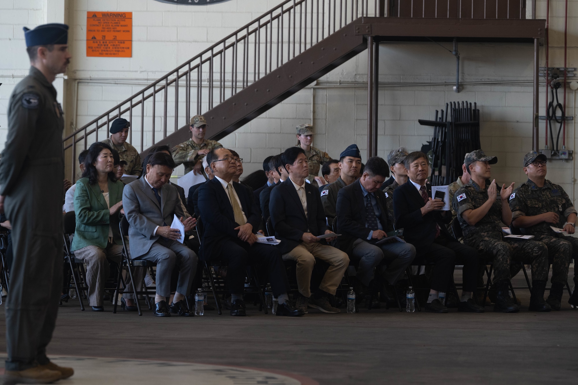 A crowd attends the change of command ceremony.