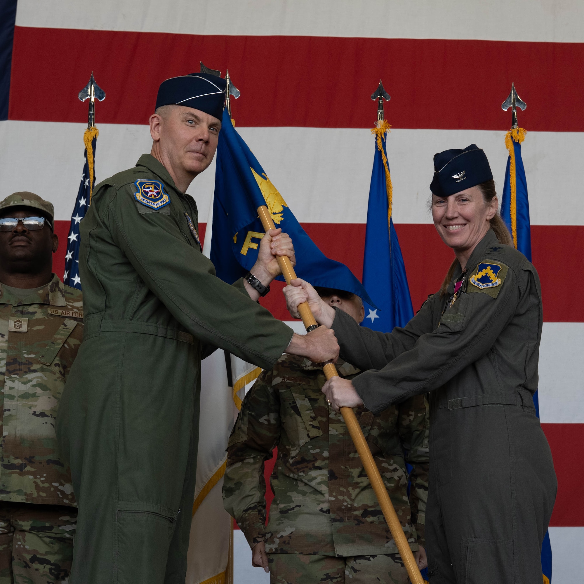Commanders pass guidon.