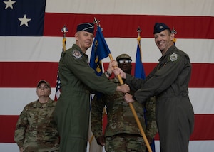 Commanders pass guidon.