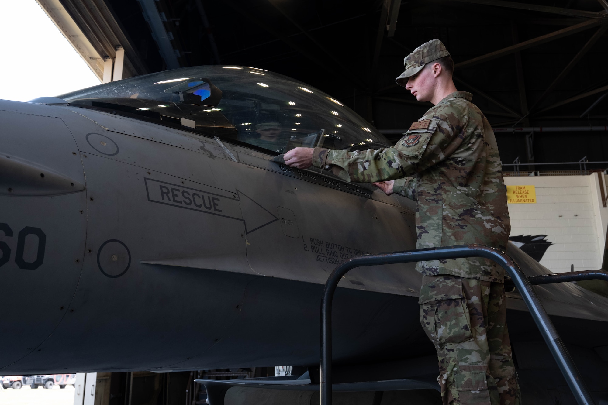 Airman removes tape.