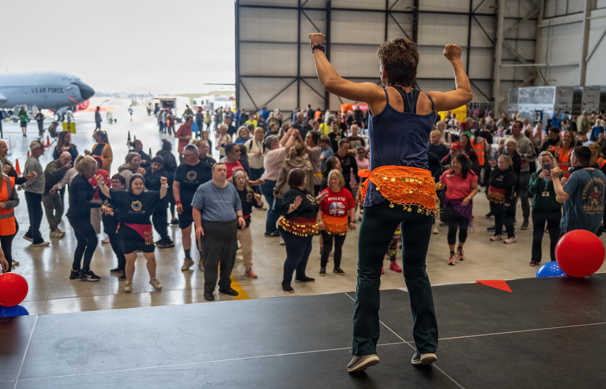 A dance instructor performs in front of a crowd of participants during Joan Mann Special Sports Day at RAF Mildenhall, England, June 4, 2026.