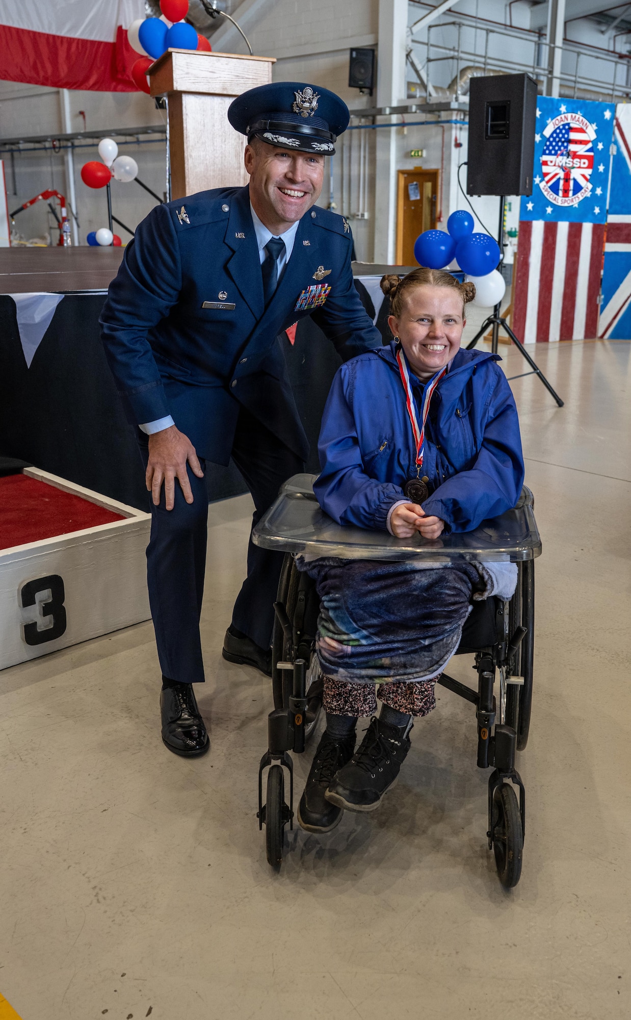 U.S. Air Force Col. Scott Korell, 100th Operations Group commander, pauses for a photo with an athlete during Joan Mann Special Sports Day at RAF Mildenhall, England, June 4, 2026.