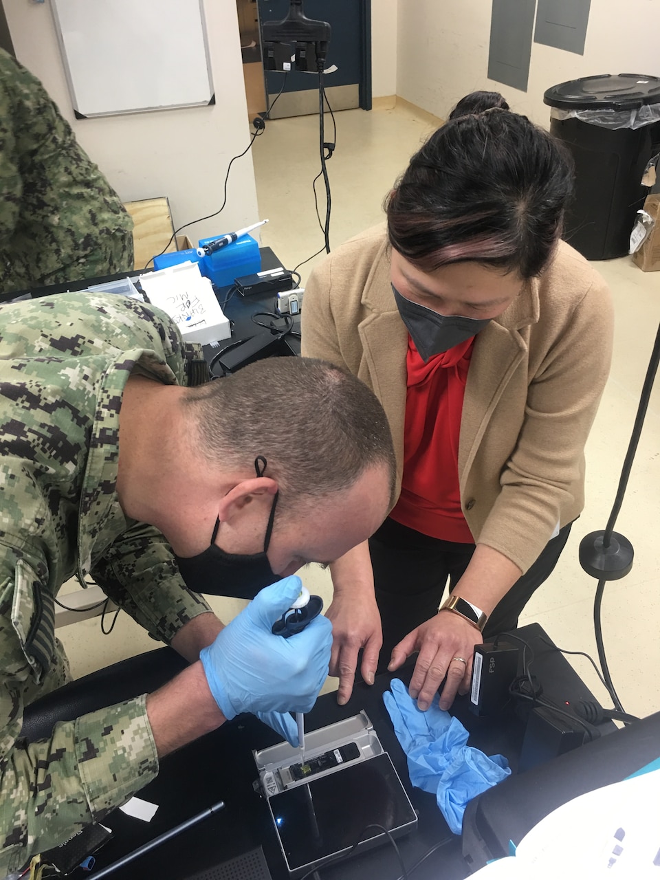 An end user loads a flow cell on a modified field sequencing device during Beholder’s Gaze training, Oct. 24, 2024. The event was attended by the U.S. Naval Research Laboratory and U.S. Army Combat Capabilities Development Command (DEVCOM) Chemical Biological Center military operators Far-Forward Advanced Sequencing Technology (F-FAST) team who conducted training and provided the technology/system. The effort brings sophisticated laboratory capability into austere environments, giving forward-deployed units the ability to detect and identify harmful pathogens in less than 30 minutes. Unlike conventional sequencing systems, Far-Forward Biological Sequencing (FFBS) is tailored for military personnel who may not have formal laboratory training. (U.S. Navy photo)