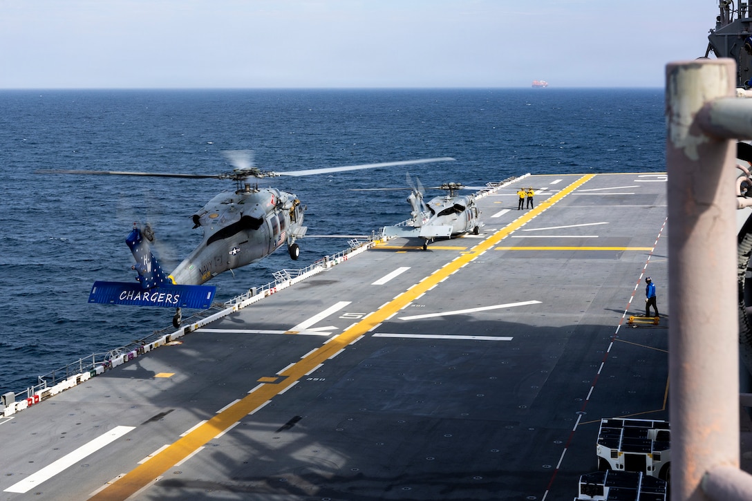 U.S. Navy MH-60S Sea Hawks assigned to Helicopter Sea Combat Squadron 26 prepare to land aboard amphibious assault ship USS Kearsarge (LHD 3) during 26th Marine Expeditionary Unit’s Type Commanders Amphibious Training (TCAT), off the coast of Virginia, June 9, 2026. TCAT is a military exercise designed to enhance mobility and integration between the U.S. Marine Corps and the U.S. Navy. The amphibious force is an integrated powerhouse providing sea, land, and air operations, giving geographic combatant commanders a more flexible, agile force for aggregated or dis-aggregated operations across the globe. (U.S. Marine Corps photo by Cpl. Matthew Williams)