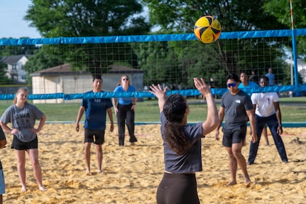 A member with the 794th Communications Squadron serves a volleyball to the 11th Logistics Readiness Squadron in a volleyball match during a base sports day at Joint Base Anacostia-Bolling, Washington, D.C., June 9, 2026. The annual event fostered teamwork, camaraderie, physical fitness and friendly competition. (U.S. Air Force photo by Hayden Hallman)
