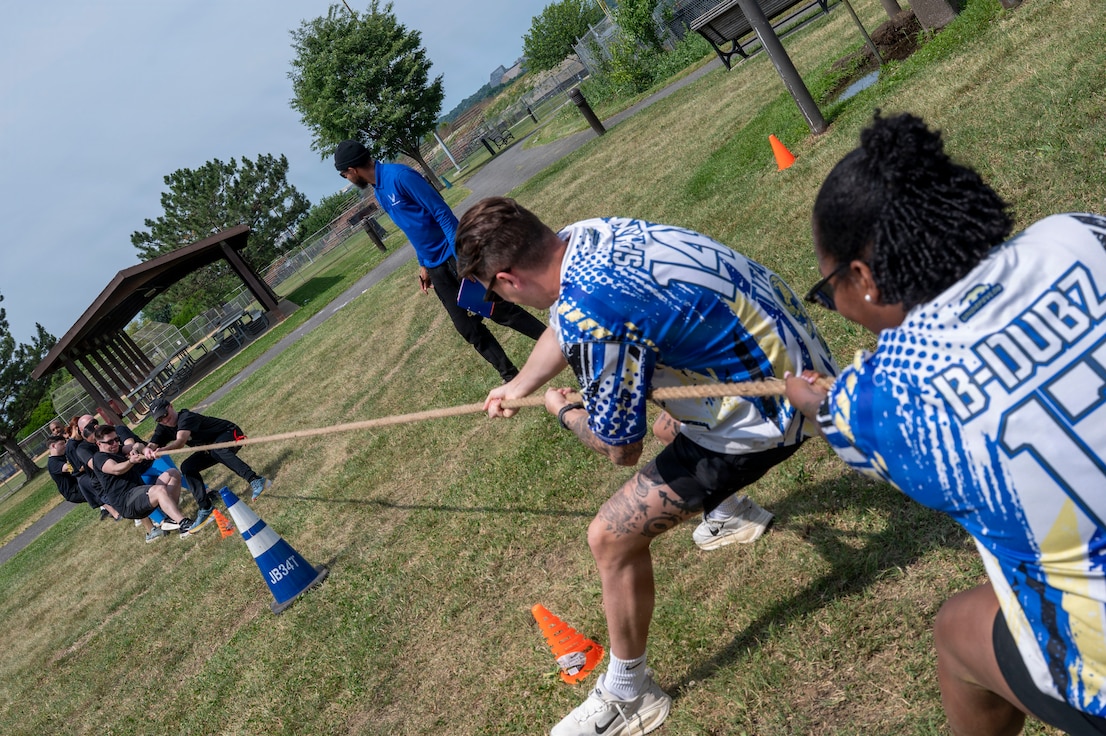 Members from the 11th Force Support Squadron, right, and members from the 11th Contracting Squadron, compete in tug-of-war during a base sports event at Joint Base Anacostia-Bolling, Washington, D.C., June 9, 2026. The annual event fostered teamwork, camaraderie, physical fitness and friendly competition. (U.S. Air Force photo by Hayden Hallman)