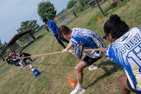 Members from the 11th Force Support Squadron, right, and members from the 11th Contracting Squadron, compete in tug-of-war during a base sports event at Joint Base Anacostia-Bolling, Washington, D.C., June 9, 2026. The annual event fostered teamwork, camaraderie, physical fitness and friendly competition. (U.S. Air Force photo by Hayden Hallman)