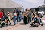 Families and friends welcome the Independence-variant littoral combat ship USS Augusta (LCS 34) as it arrives at Naval Station San Diego following six months of operations in the U.S. 3rd Fleet area of operations, June 11, 2026. While deployed, Augusta was the first ship to integrate U.S. Navy aviation assets, Aerosonde Uncrewed Aerial Systems, and a U.S. Coast Guard Maritime Law Enforcement Detachment on the same platform to enable multi-domain operations. Augusta is a fast, optimally manned, mission-tailored surface combatant that operates in near-shore and open-ocean environments, winning against 21st-century coastal threats. LCS, like Augusta, integrate with joint, combined, manned and unmanned teams to support forward presence, maritime security, sea control, and deterrence missions around the globe. (U.S. Navy photo by Mass Communication Specialist 2nd Class Kassandra Alanis)