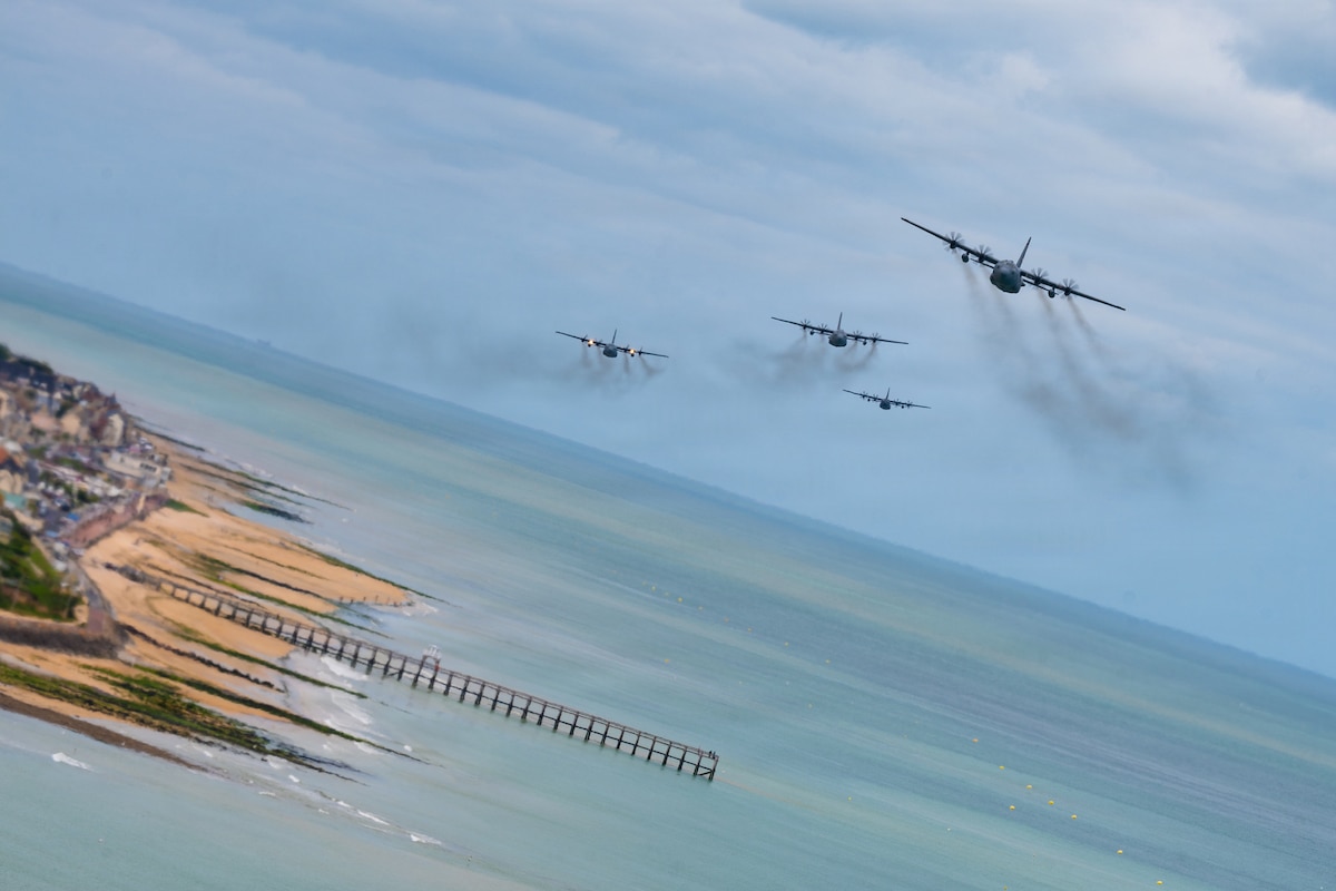 Four U.S. Air Force C-130J Super Hercules aircraft fly over Normandy, France, during a D-Day commemorative airborne operation June 7, 2026. The airborne operation commemorated the historic D-Day invasion while reinforcing the enduring partnership between U.S. and Allied military forces in Europe. (U.S. Air Force photo by Tech. Sgt. Cynthia Belío)