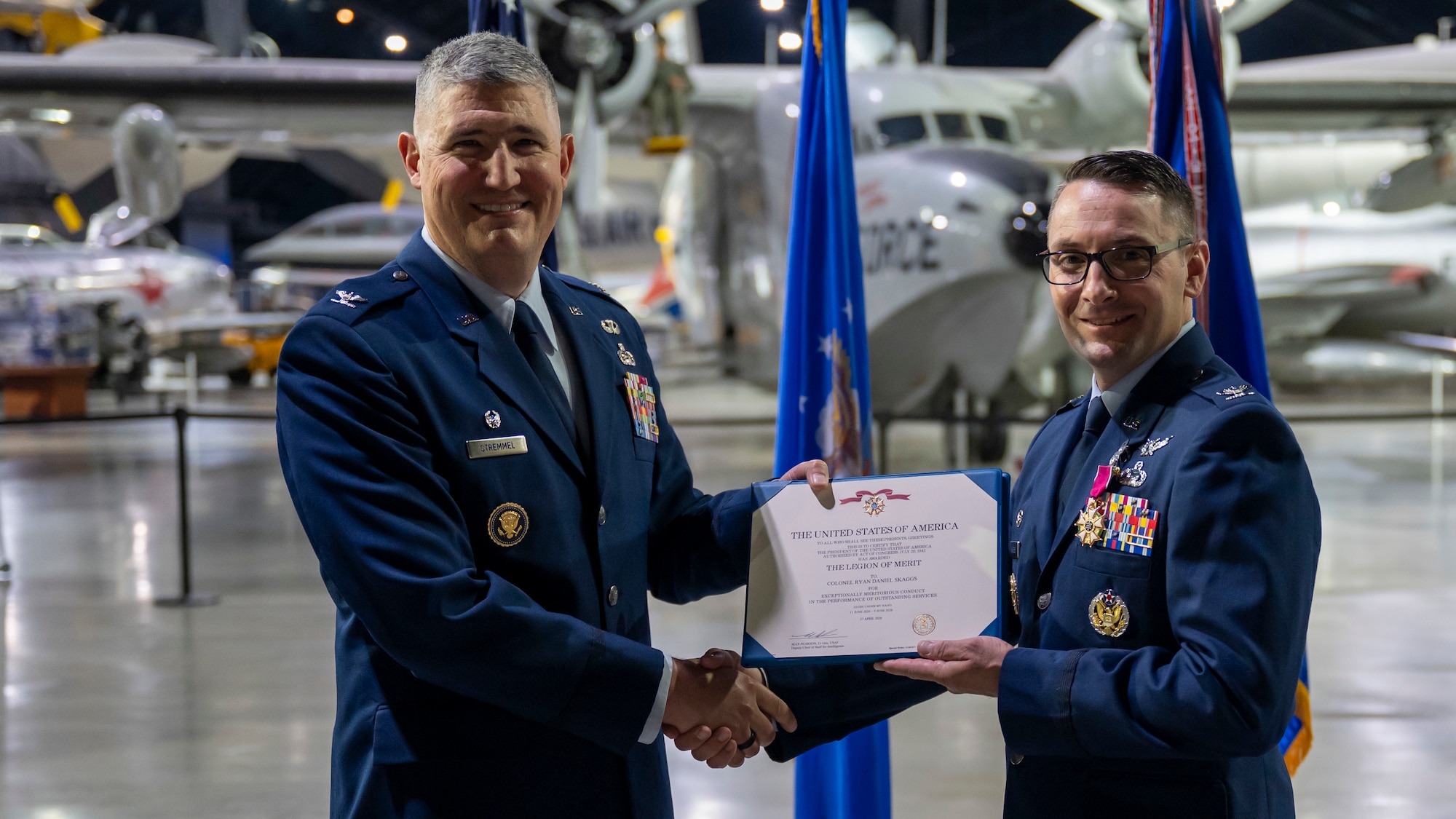 From left, Col. Kenneth Stremmel presents Col. Ryan Skaggs with a Legion of Merit decoration.