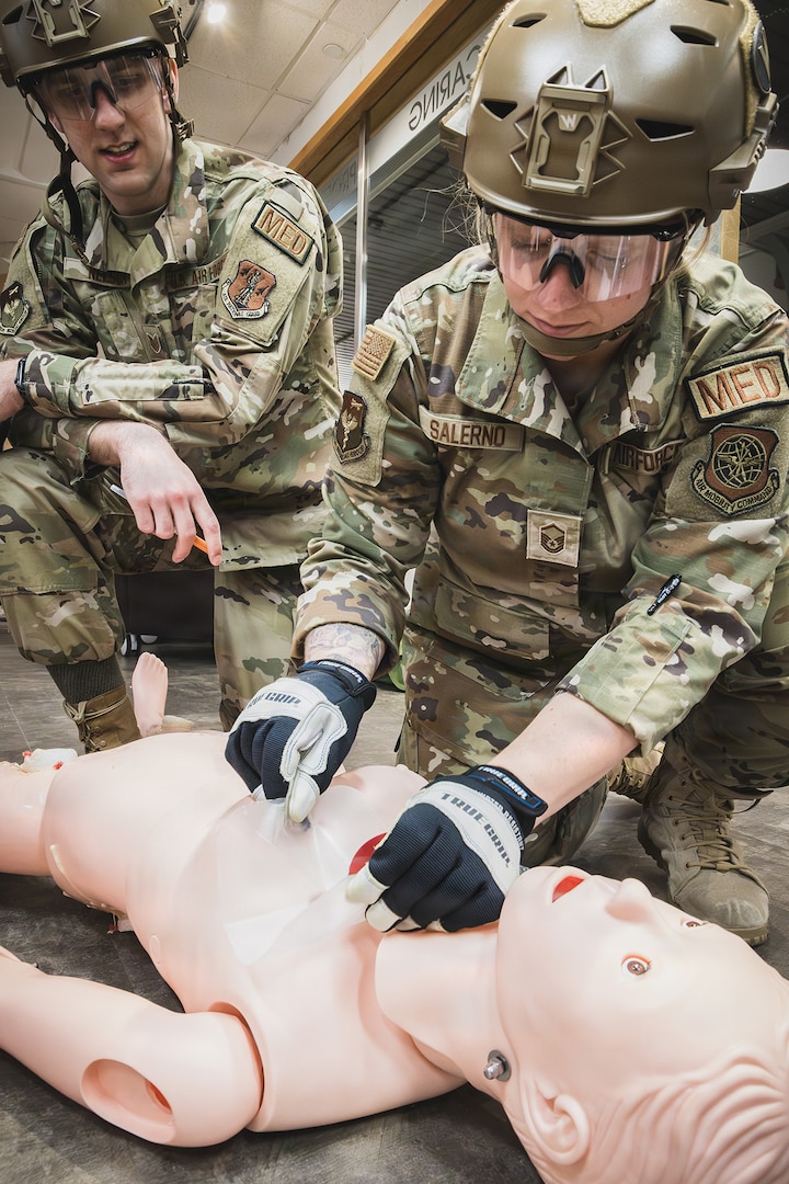 Master Sgt. Cailee Salerno demonstrated a proper chest seal application during the Health Applied Combat Medic Skills Course, Bangor, Maine, June 6, 2026.