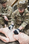 Master Sgt. Cailee Salerno demonstrated a proper chest seal application during the Health Applied Combat Medic Skills Course, Bangor, Maine, June 6, 2026.