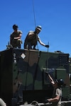 U.S. Air Force Tech. Sgt. Conner Kin, Senior Airman Jacob Quintero, and Airman 1st Class Mason Turner,
radio frequency transmission systems technicians assigned to the 123rd Air Control Squadron, install cable roof mounted antennas for the AN/TRC-214 ground-to-air command and control radio shelter June 1, 2026 for a field training exercise at the Alpena Combat Readiness Training Center in Michigan. Annual training allows Airmen to focus on readiness and proficiency items, future fighting concepts and maintaining a war-ready posture for members of the Air National Guard. Photo by Shane Hughes.