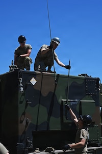 U.S. Air Force Tech. Sgt. Conner Kin, Senior Airman Jacob Quintero, and Airman 1st Class Mason Turner,
radio frequency transmission systems technicians assigned to the 123rd Air Control Squadron, install cable roof mounted antennas for the AN/TRC-214 ground-to-air command and control radio shelter June 1, 2026 for a field training exercise at the Alpena Combat Readiness Training Center in Michigan.