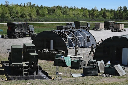 Airmen assigned to the 123rd Air Control Squadron set up tents June 1, 2026 for a field training exercise at the Alpena Combat Readiness Training Center in Michigan.