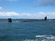 GARDEN ISLAND, HMAS Stirling, Western Australia, Australia (October 29, 2025) – USS Vermont (SSN 792) arrives at HMAS Stirling, Western Australia on Oct. 29, as part of a scheduled port visit before a planned submarine maintenance period (SMP). The SMP showcased Pearl Harbor Naval Shipyard & Intermediate Maintenance Facility’s ability to conduct maintenance in Western Australia and its training of Australian maintainers to support the establishment of Submarine Rotational Force – West as early as 2027 as part of AUKUS Pillar I, the trilateral security agreement between Australia, the United Kingdom and the United States. The AUKUS I&A Program Office is the U.S. Navy office responsible for executing the trilateral partnership to assist Australia in acquiring conventionally armed, nuclear-powered attack submarines at the earliest possible date while setting the highest nuclear stewardship standards and continuing to maintain the highest nonproliferation standard. (U.S. Navy Photo by Ashley Calingo)