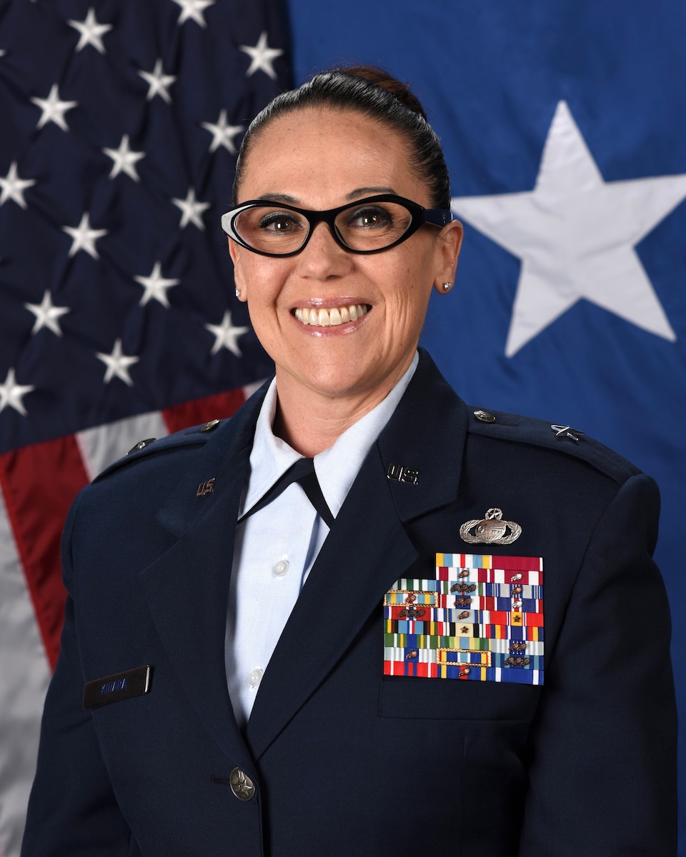 A photo of a U.S. Air Force female in service dress.
