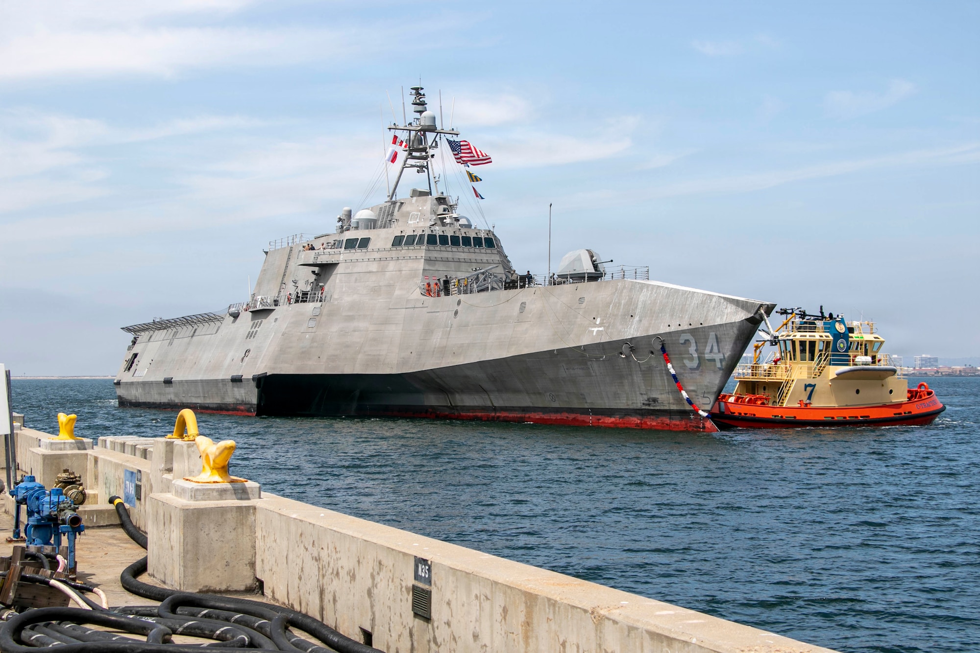 The Independence-variant littoral combat ship USS Augusta (LCS 34) arrives at Naval Station San Diego following six months of operations in the U.S. 3rd Fleet area of operations, June 11, 2026. While deployed, Augusta was the first ship to integrate U.S. Navy aviation assets, Aerosonde Uncrewed Aerial Systems, and a U.S. Coast Guard Maritime Law Enforcement Detachment on the same platform to enable multi-domain operations. Augusta is a fast, optimally manned, mission-tailored surface combatant that operates in near-shore and open-ocean environments, winning against 21st-century coastal threats. LCS, like Augusta, integrate with joint, combined, manned and unmanned teams to support forward presence, maritime security, sea control, and deterrence missions around the globe. (U.S. Navy photo by Mass Communication Specialist 2nd Class Kassandra Alanis)
