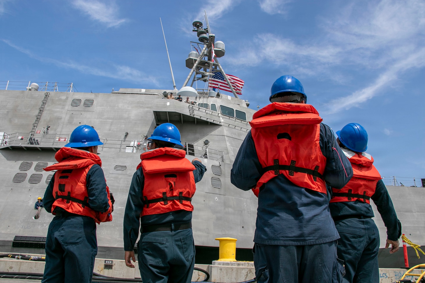Sailors prepare to handle mooring lines as the Independence-variant littoral combat ship USS Augusta (LCS 34) arrives at Naval Station San Diego following six months of operations in the U.S. 3rd Fleet area of operations, June 11, 2026. While deployed, Augusta was the first ship to integrate U.S. Navy aviation assets, Aerosonde Uncrewed Aerial Systems, and a U.S. Coast Guard Maritime Law Enforcement Detachment on the same platform to enable multi-domain operations. Augusta is a fast, optimally manned, mission-tailored surface combatant that operates in near-shore and open-ocean environments, winning against 21st-century coastal threats. There is no substitute for presence. LCS, like Augusta, integrate with joint, combined, manned and unmanned teams to support forward presence, maritime security, sea control, and deterrence missions around the globe. (U.S. Navy photo by Mass Communication Specialist 2nd Class Kassandra Alanis)