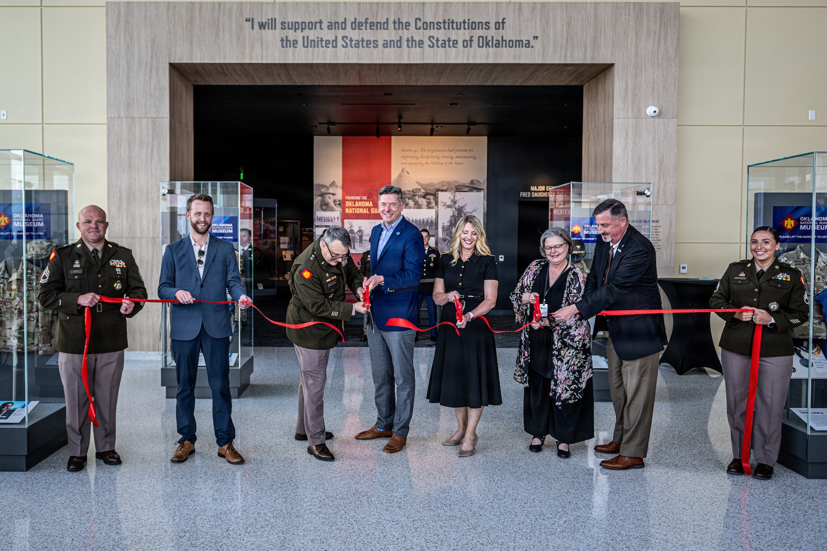 (Left to Right) Jay Fox, Hensel Phelps Construction; Maj. Gen. Thomas H. Mancino, adjutant general for Oklahoma, Mayor David Holt, mayor of Oklahoma City, Mrs. Cindy Lankford, representing Senator James Lankford; Dr. Denise Neil, Oklahoma National Guard Museum executive director, join in the ribbon cutting for the Oklahoma National Guard Museum in Oklahoma City, June 11, 2026. (Oklahoma National Guard photo by Anthony Jones)