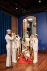 Vice Adm. Johnny Wolfe Jr., the outgoing director of Portfolio Acquisition Executive (PAE) Strategic Systems Programs (SSP), is accompanied by his wife while being piped ashore at the PAE SSP Change of Command ceremony in Washington D.C., on June 12, 2026. The event highlighted the transfer of leadership from Vice Adm. Johnny Wolfe Jr., to Vice Adm. Douglas L. Williams. Williams assumes command of PAE SSP as the 15th director in program history.