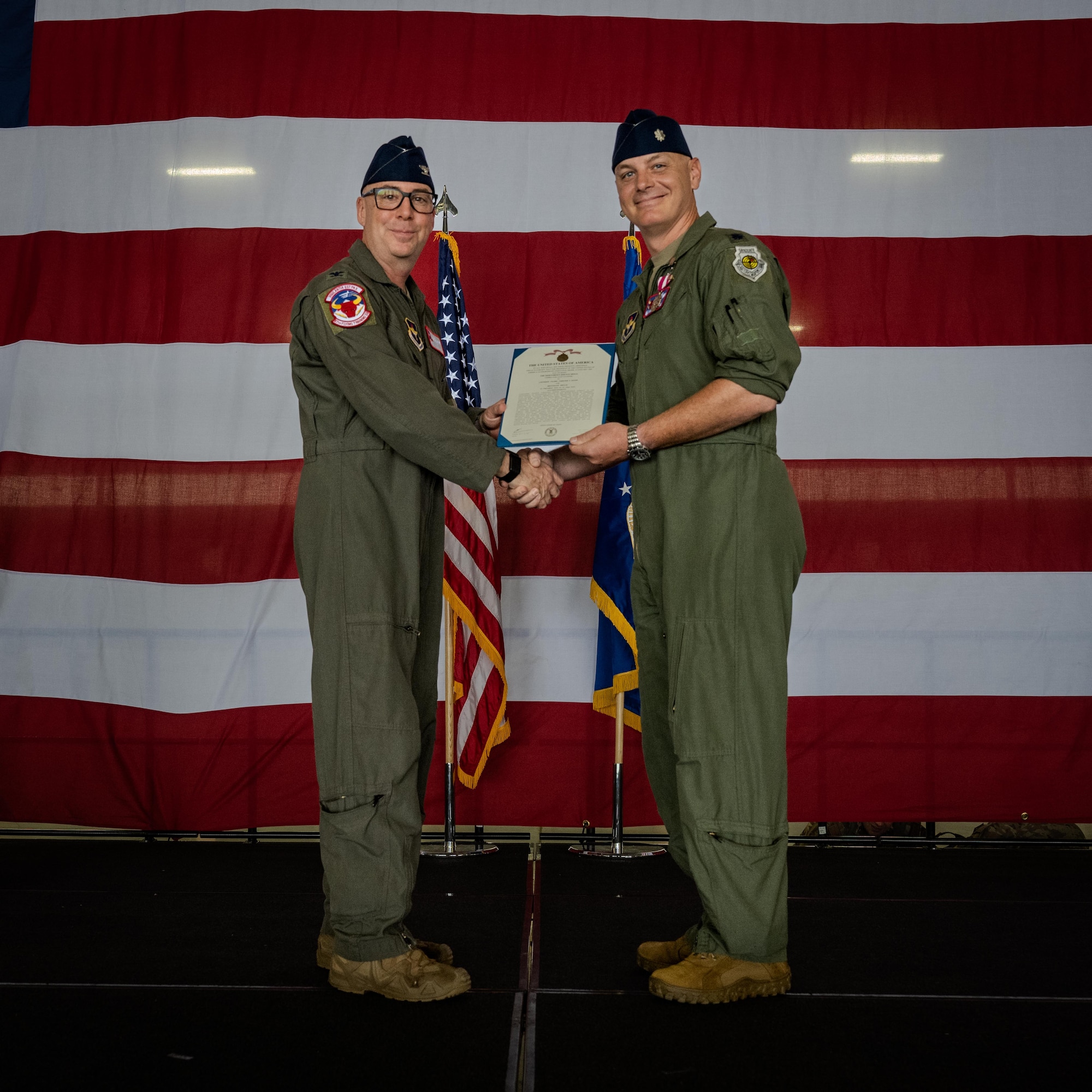 U.S. Air Force Col. Eric Bissonette, 47th Flying Training Wing commander, presents the meritorious service medal to Lt. Col. Johnathan Radtke, 87th Flying Training Squadron outgoing commander, during a change of command ceremony at Laughlin Air Force Base, Texas, June 12, 2026. The Meritorious Service Medal was established as the counterpart of the Bronze Star Medal for the recognition of meritorious noncombatant service. (U.S. Air Force photo by Airman 1st Class Harrison Sullivan)