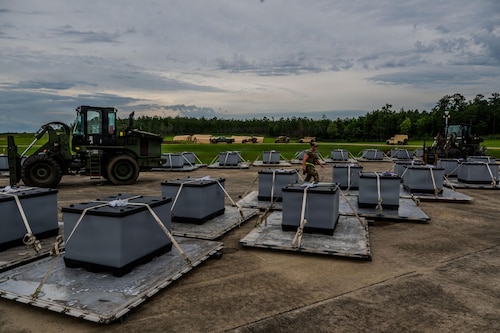 A man checks cargo.