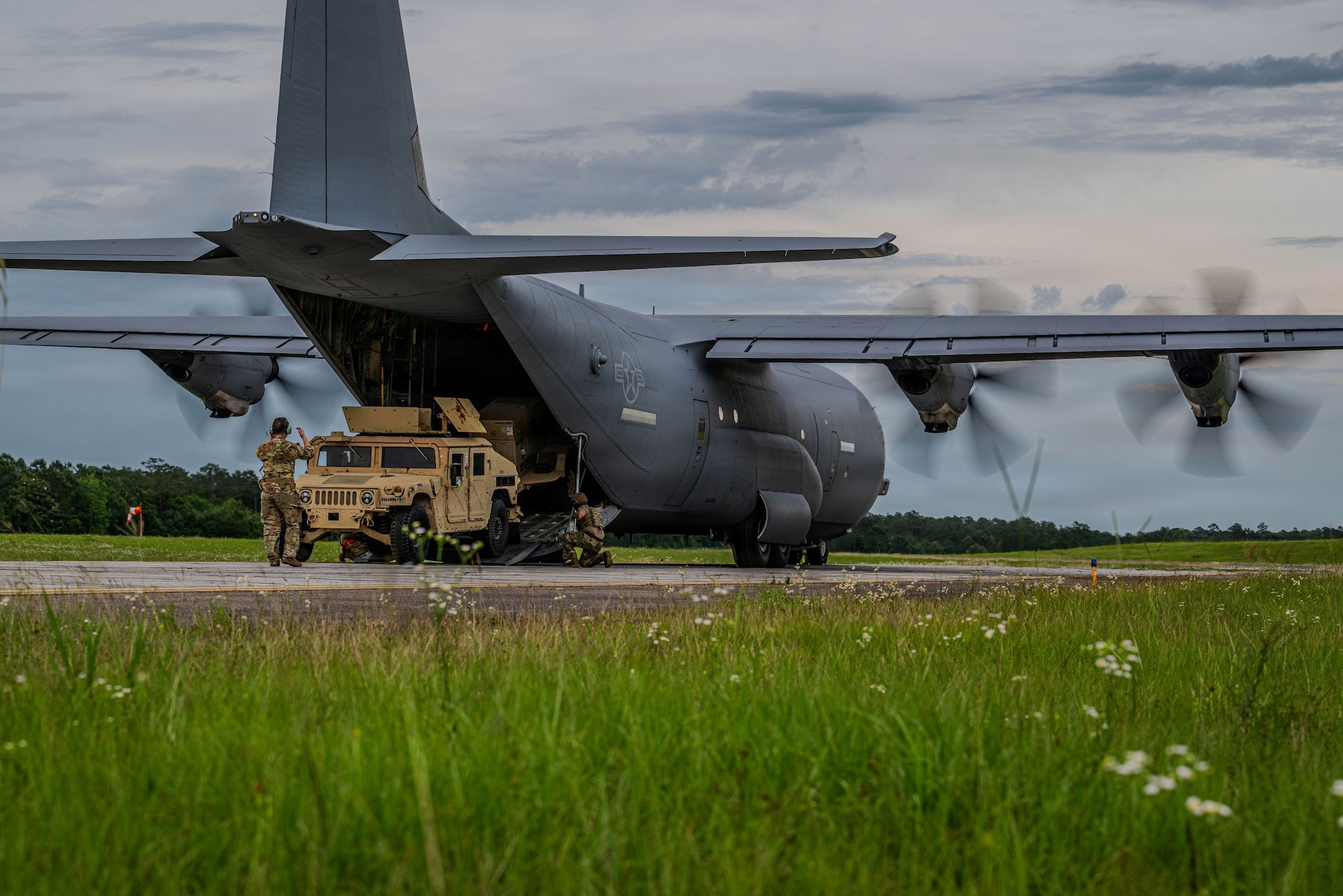Men unload a plane.