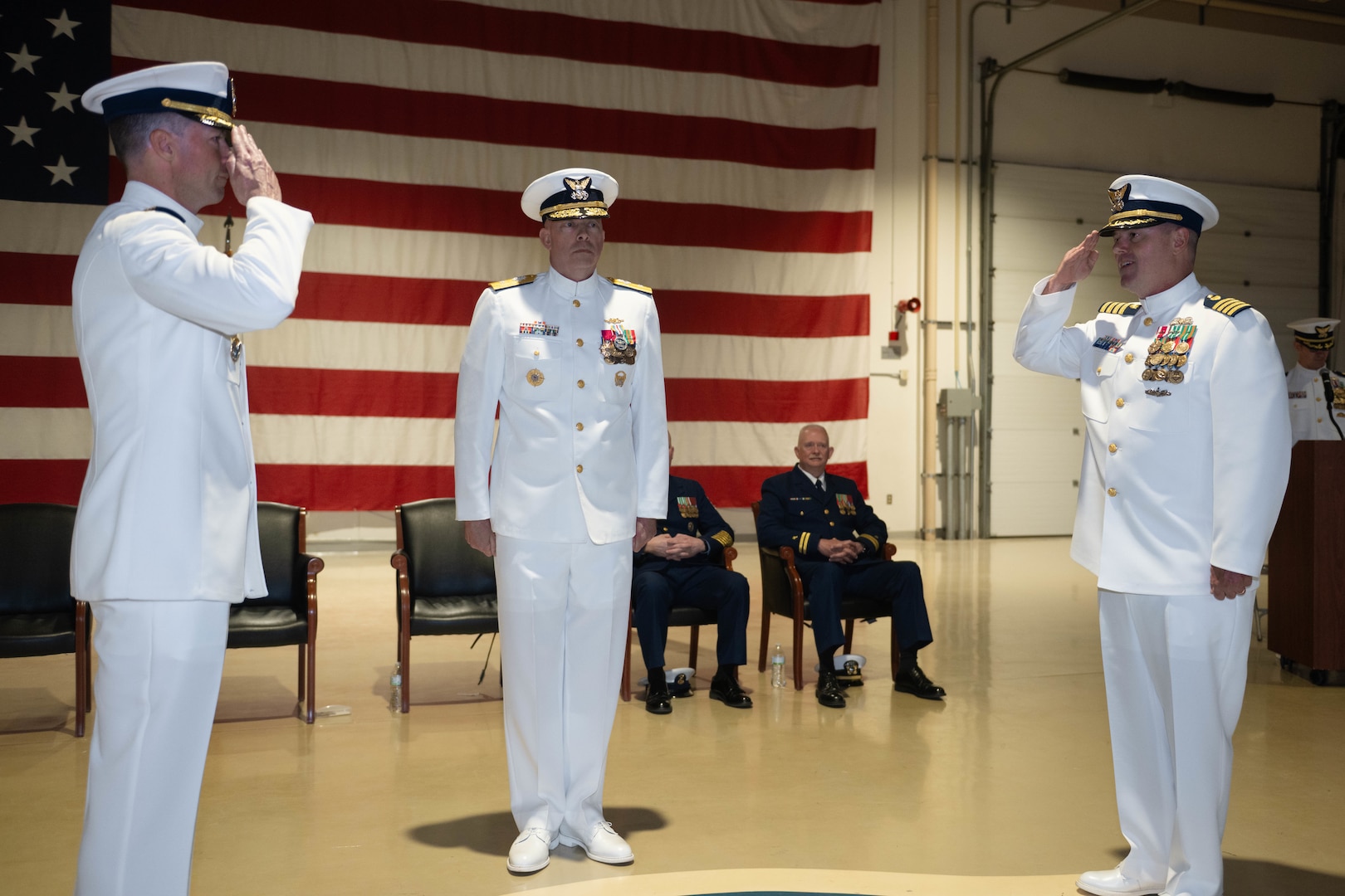 U.S. Coast Guard Capt. Joel Carse, sector commander of Sector Western Alaska and U.S. Arctic, salutes Capt. Christopher Culpepper to relieve him of duty as the sector commander at a change of command ceremony at Joint Base Elmendorf-Richardson, Alaska, June 12, 2026.