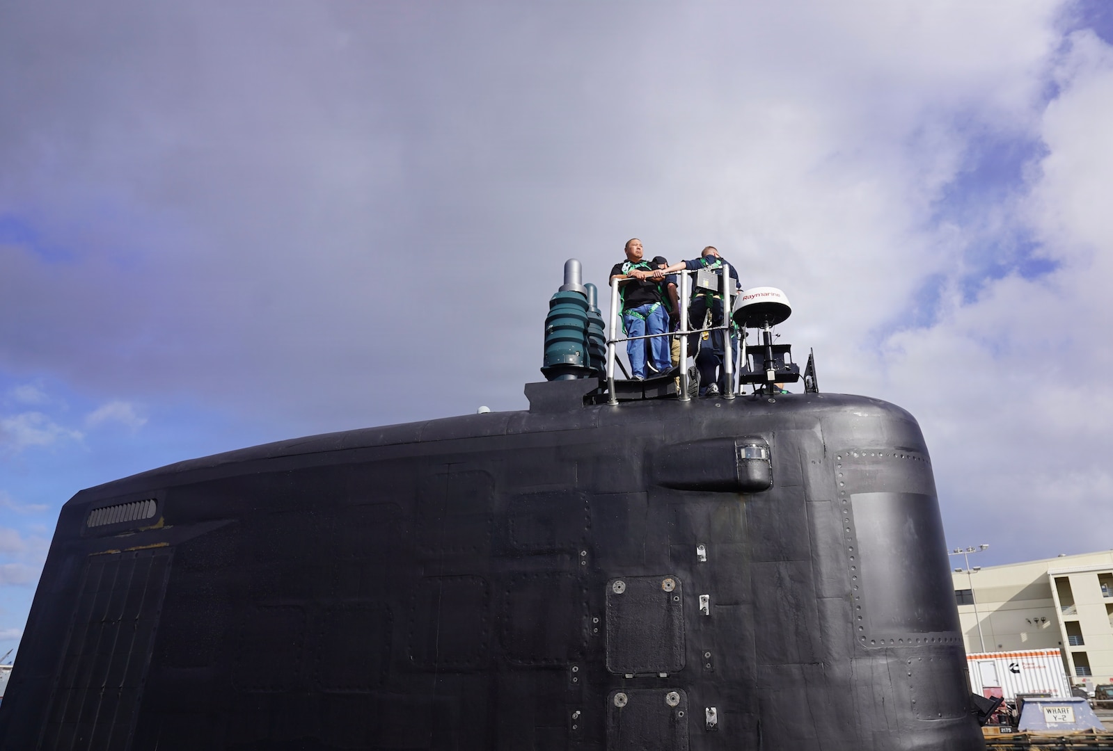 Chad Renti Cruz, Pearl Harbor Naval Shipyard and Intermediate Maintenance Facility (PHNSY & IMF) project superintendent for USS Colorado (SSN 788) stands atop the Virginia-class fast-attack submarine during its return from sea trials during a maintenance period at Joint Base Pearl Harbor-Hickam, June 6, 2026.