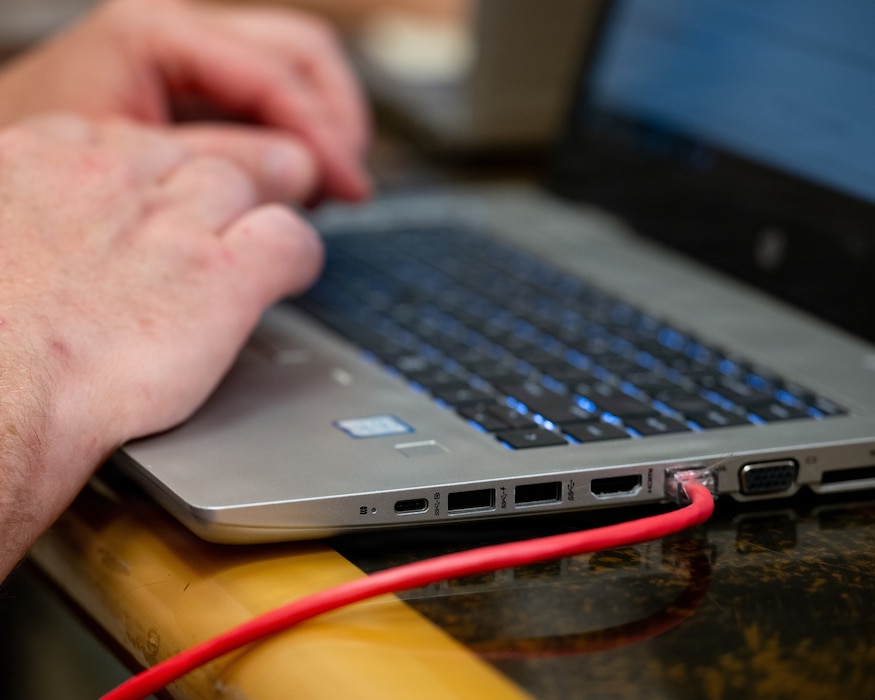 U.S. Air Force Master Sgt. Jason Girvin, 439th Mission Support Group talent management consultant, works on a laptop connected to a live network during the Innovative Readiness Training program’s Cyber Guam 2026 training activity in Hagåtña, Guam, June 1, 2026.