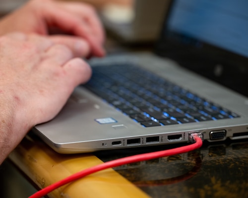 U.S. Air Force Master Sgt. Jason Girvin, 439th Mission Support Group talent management consultant, works on a laptop connected to a live network during the Innovative Readiness Training program’s Cyber Guam 2026 training activity in Hagåtña, Guam, June 1, 2026.