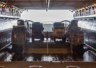 Landing Craft, Air Cushion (LCAC) 90, attached to Assault Craft Unit 5, sits in the well deck of Wasp-class amphibious assault ship USS Essex (LHD 2) during LCAC operations, June 8, 2026, in preparation for RIMPAC 2026.