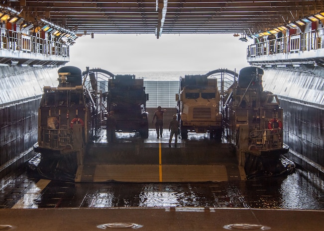 Landing Craft, Air Cushion (LCAC) 90, attached to Assault Craft Unit 5, sits in the well deck of Wasp-class amphibious assault ship USS Essex (LHD 2) during LCAC operations, June 8, 2026, in preparation for RIMPAC 2026.