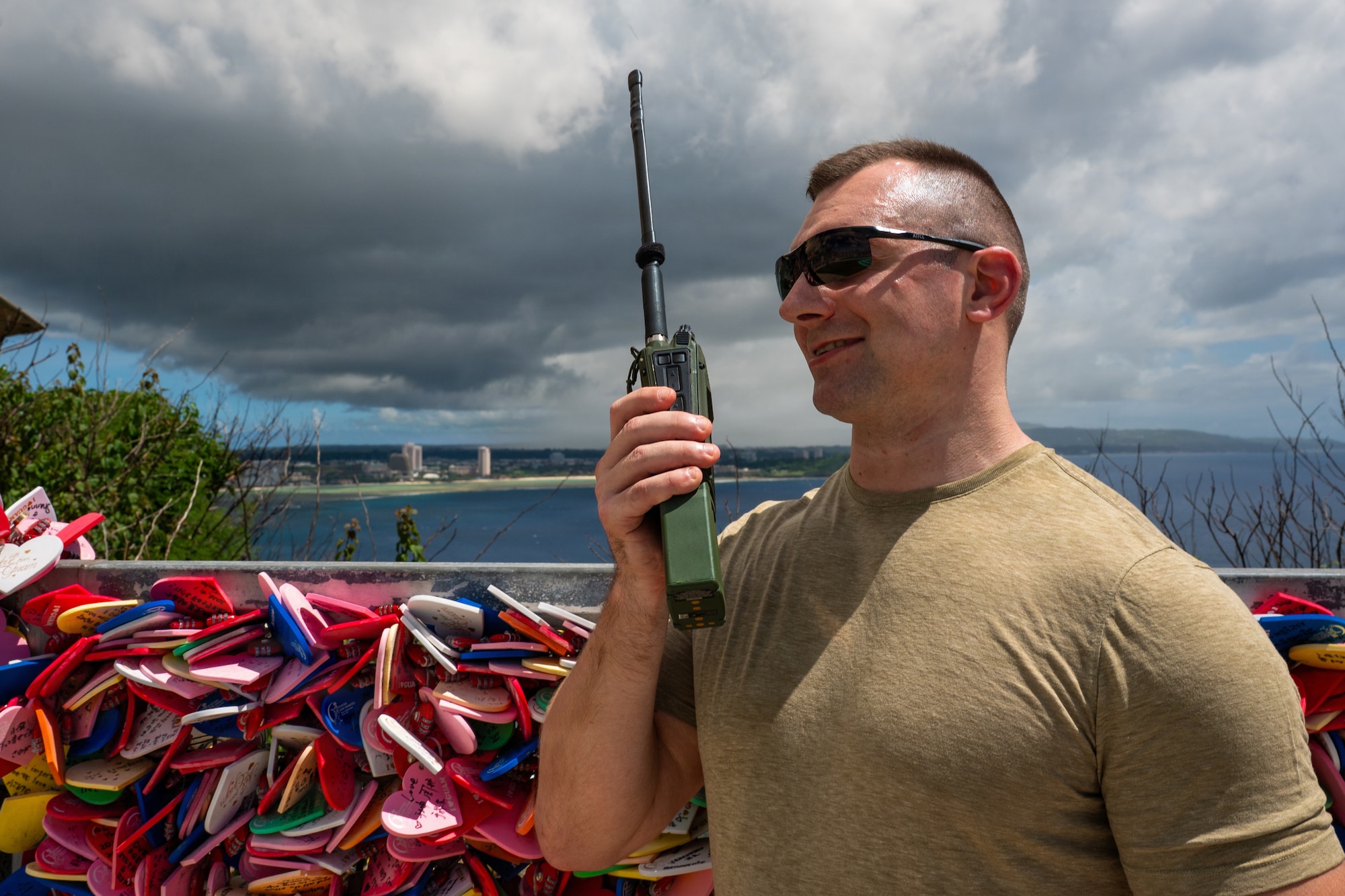 U.S. Air Force Staff Sgt. Marcin Drozd, 439th Aeromedical Evacuation Squadron expeditionary communication technician, communicates over an AN/PRC-163 multi-channel handheld radio during Cyber Guam 2026 in Tamuning, Guam, June 4, 2026.