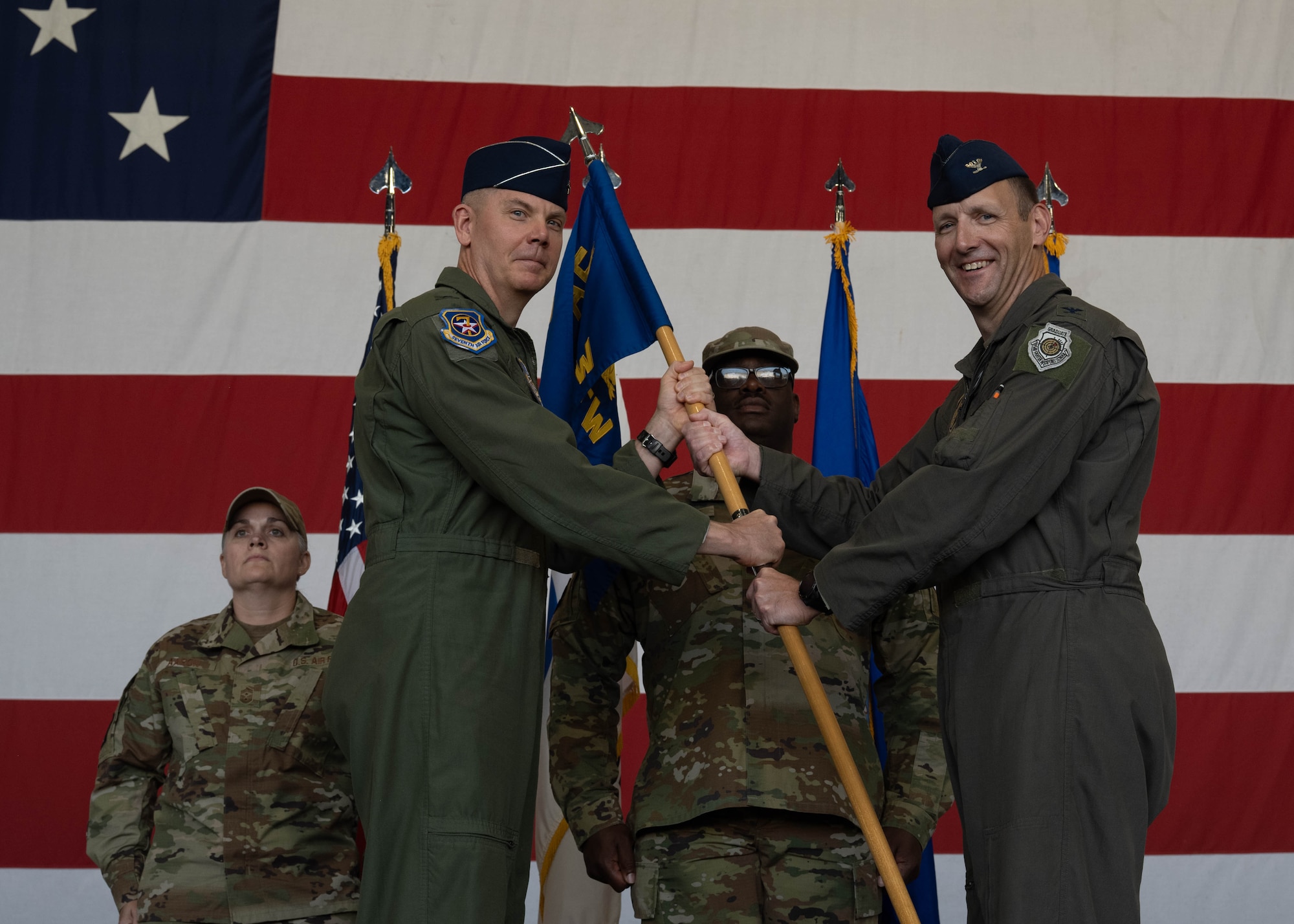 Commanders pass guidon.
