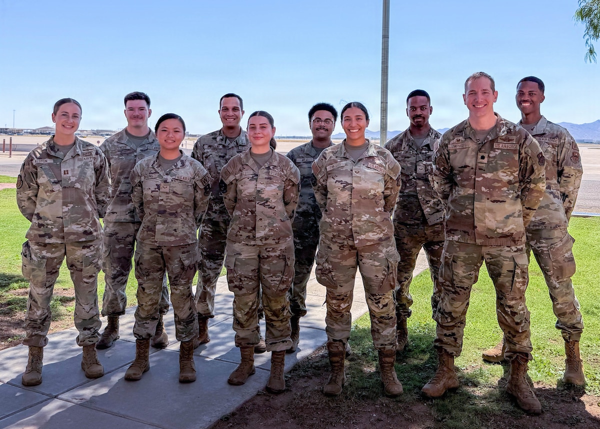 U.S. Air Force weather forecasters assigned to the 56th Operations Support Squadron pose for a group photo at Luke Air Force Base, Arizona, June 9, 2026. During Monsoon Awareness Week, Luke AFB weather forecasters partnered with the National Weather Service to educate Airmen and community members on severe weather hazards and preparedness throughout Arizona's monsoon season. (Courtesy photo)