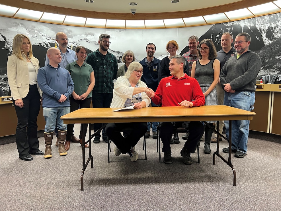 Beth Weldon, mayor of Juneau, and Daryl Downing signed the Amended Cooperative Agreement to provide Advance Measures Assistance during the October 30 Special Assembly Committee of the Whole meeting at the Assembly Chambers in Juneau.