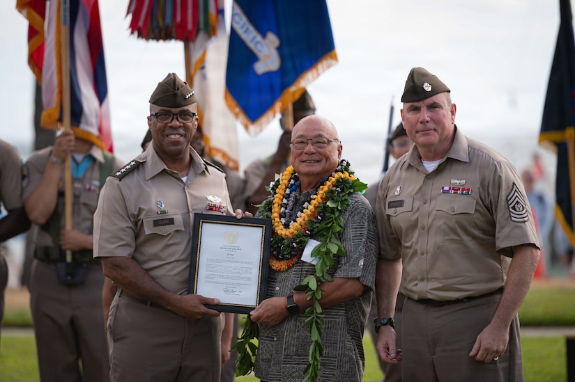 U.S. Army Gen. Ronald P. Clark, United States Army Pacific (USARPAC) Commanding General, left, presents the Mana O Ke Koa (Spirit of the Warrior) award to Mr. Gil Tam, Ke’ehi Memorial Organization, Director and Treasurer, center, with Sgt. Maj. Jason Schmidt, command   at Fort DeRussy, June 12, 2026.