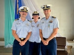 Lt. Gabriel LaMartina (left), Lt. Justin Miller (right), and Capt. Jesica Worst, the presiding official, stand for a photo following a change of command ceremony for Marine Safety Unit Saipan in Saipan, Commonwealth of the Northern Mariana Islands, on June 13, 2026. During Miller's tenure from October 2023 to June 2026, MSU Saipan stood up as a full Marine Safety Unit — elevated from Marine Safety Detachment Saipan on April 5, 2024 — and matured into the Coast Guard's permanent prevention and response presence across the Commonwealth. Under his leadership, the unit advanced maritime safety, security, and environmental stewardship through vessel inspections, port state control examinations, container inspections, and continuous engagement with port partners and local leaders. (U.S. Coast Guard photo by Dee Cruz)