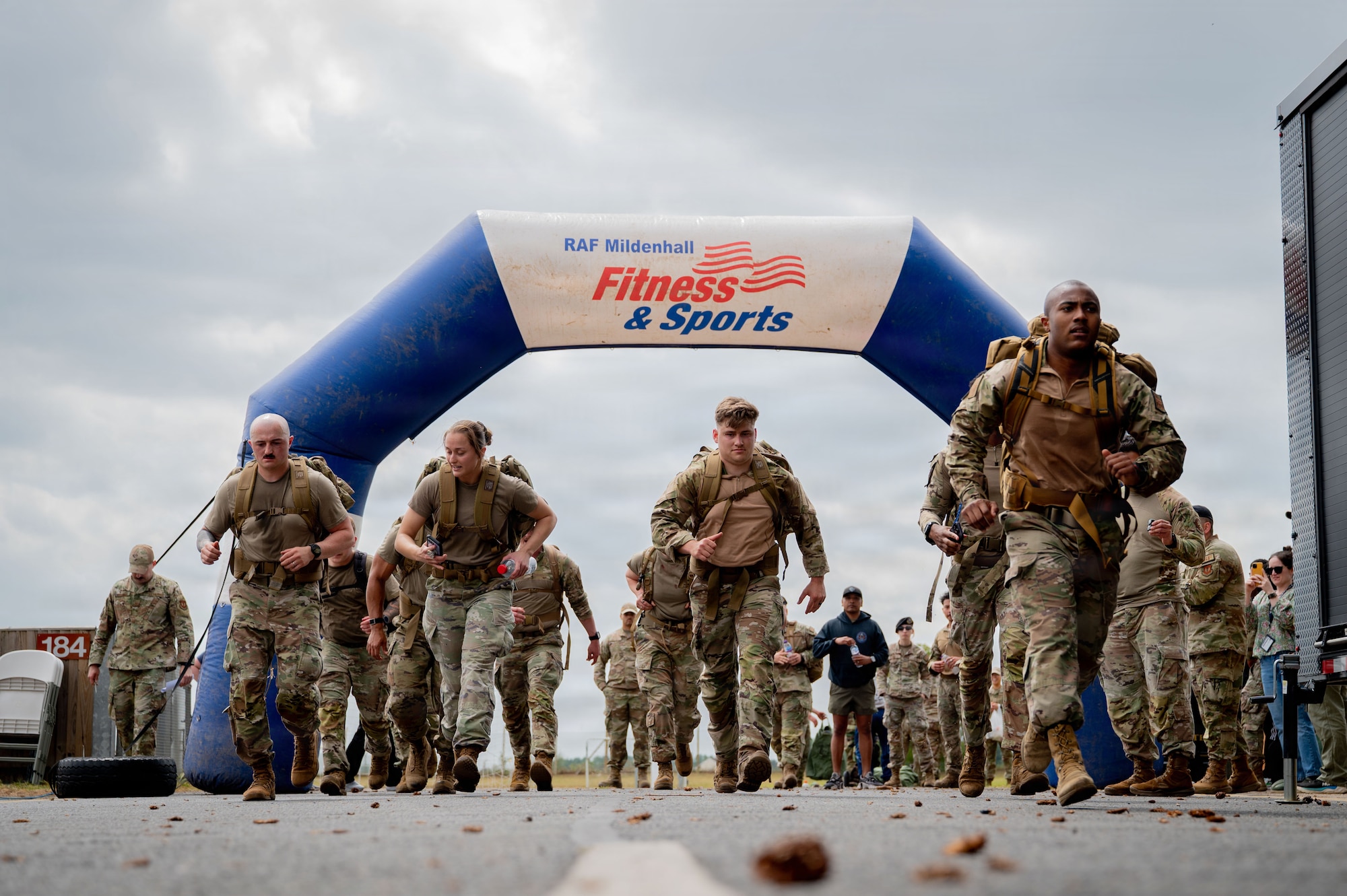 Airmen begin ruck in warrior fitness challenge. 