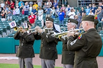 From left to right, Chief Warrant Officer 5, Staff Sgt. Brian Bull, Sgt. 1st Class Chris Hartsock, Sgt. 1st Class Joel Heredia, and Master Sgt. Robert Leatherbee, all with the U.S. Army Recruiting Operations Division, play the Star-Spangled Banner before an Indianapolis Indians baseball game at Victory Field in Indianapolis June 12, 2026. The Indians paid special tribute to the 251st birthdays of both the U.S. Army and Army Finance Corps. (U.S. Army photo by Mark R. W. Orders-Woempner)