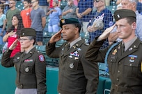 Brig. Gen. Sara Dudley, U.S. Army Recruiting Division commanding general, Lt. Col. Kerry Zanders, Indianapolis Recruiting Battalion commander, and 1st Lt. Williams, USARD aide-de-camp, salute during the playing of the Start-Spangled Banner before an Indianapolis Indians baseball game at Victory Field in Indianapolis June 12, 2026. The Indians paid special tribute to the 251st birthdays of both the U.S. Army and Army Finance Corps. (U.S. Army photo by Mark R. W. Orders-Woempner)