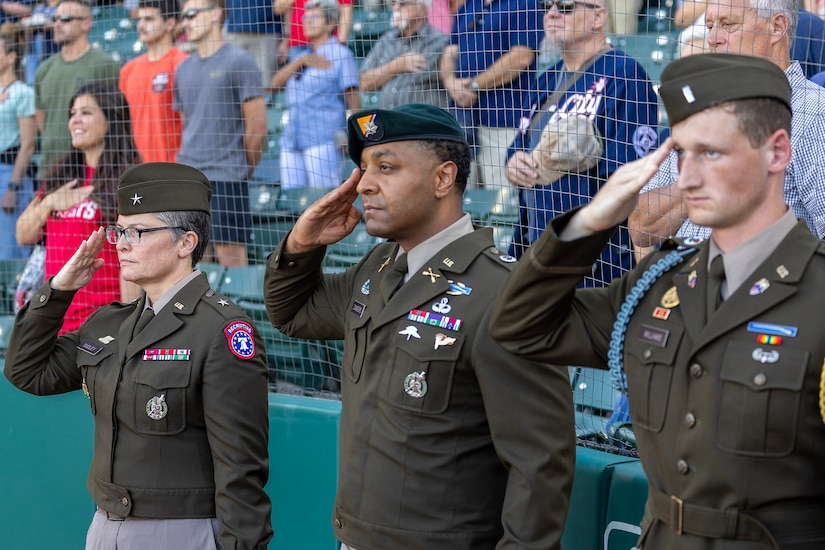 Brig. Gen. Sara Dudley, U.S. Army Recruiting Division commanding general, Lt. Col. Kerry Zanders, Indianapolis Recruiting Battalion commander, and 1st Lt. Williams, USARD aide-de-camp, salute during the playing of the Start-Spangled Banner before an Indianapolis Indians baseball game at Victory Field in Indianapolis June 12, 2026. The Indians paid special tribute to the 251st birthdays of both the U.S. Army and Army Finance Corps. (U.S. Army photo by Mark R. W. Orders-Woempner)