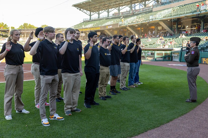 Brig. Gen. Sara Dudley, U.S. Army Recruiting Division commanding general, administers the Oath of Enlistment to 16 Future Soldiers before an Indianapolis Indians baseball game at Victory Field in Indianapolis June 12, 2026. The Indians paid special tribute to the 251st birthdays of both the U.S. Army and Army Finance Corps. (U.S. Army photo by Mark R. W. Orders-Woempner)
