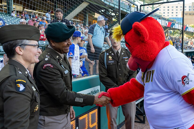 Rowdy, Indianapolis Indians mascot, greets Brig. Gen. Sara Dudley, U.S. Army Recruiting Division commanding general, left, and Lt. Col. Kerry Zanders, Indianapolis Recruiting Battalion commander, before an Indianapolis Indians baseball game at Victory Field in Indianapolis June 12, 2026. The Indians paid special tribute to the 251st birthdays of both the U.S. Army and Army Finance Corps. (U.S. Army photo by Mark R. W. Orders-Woempner)