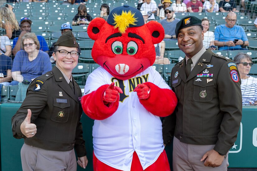 Rowdy, Indianapolis Indians mascot, poses for a photo with Brig. Gen. Sara Dudley, U.S. Army Recruiting Division commanding general, left, and Lt. Col. Kerry Zanders, Indianapolis Recruiting Battalion commander, before an Indianapolis Indians baseball game at Victory Field in Indianapolis June 12, 2026. The Indians paid special tribute to the 251st birthdays of both the U.S. Army and Army Finance Corps. (U.S. Army photo by Mark R. W. Orders-Woempner)